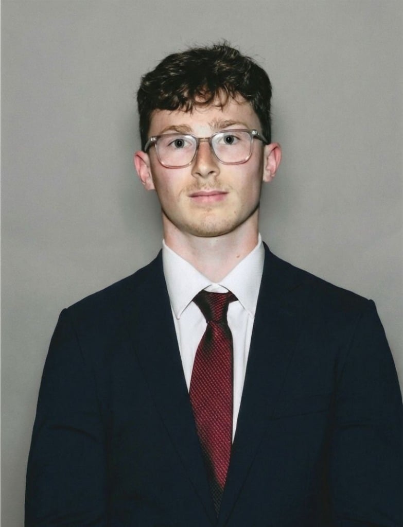 Portrait of a young male investment researcher, short hair, wearing modern glasses, serious analytical expression, black and white vector illustration, clean lines, professional corporate headshot, high contrast, serious expression, financial institution aesthetic.